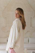 Load image into Gallery viewer, Woman wearing a white corduroy jacketand pink shorts against a neutral background
