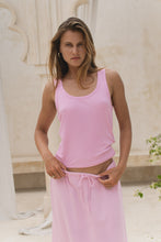 Load image into Gallery viewer, Woman wearing a pink tank top and pink skirt in an outdoor setting.
