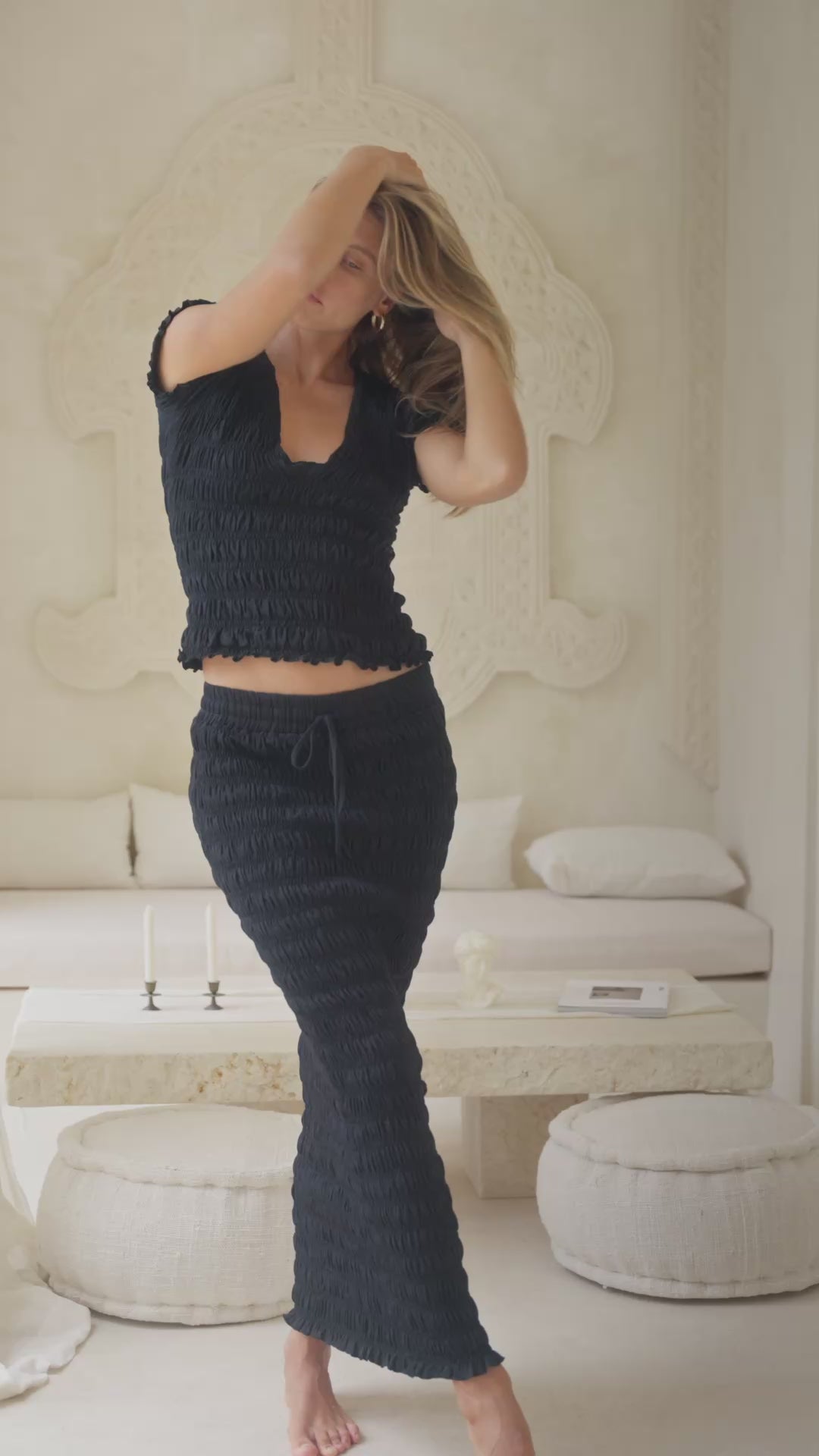 Load video: woman in black shirred top and shirred maxi skirt