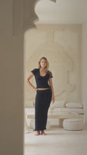 Load and play video in Gallery viewer, woman in black shirred top and shirred maxi skirt
